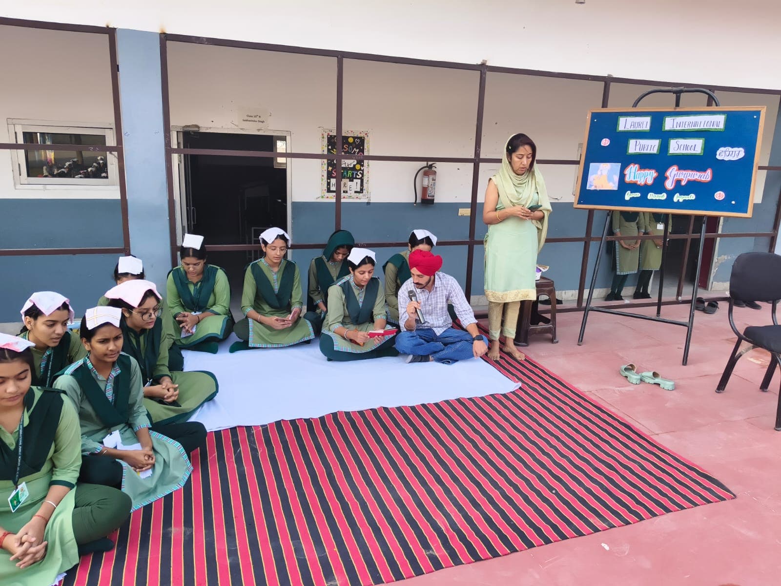 Students seated for a Gurpurab assembly